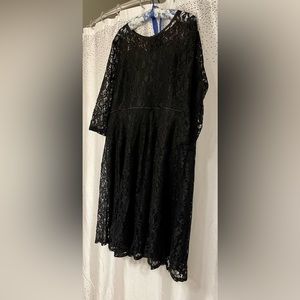 Black lace dress with lining. Mid-length with 3/4-length sleeves.